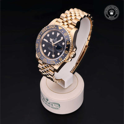 Rolex Certified Pre-owned GMT II M126718GRNR-0001 front on black background