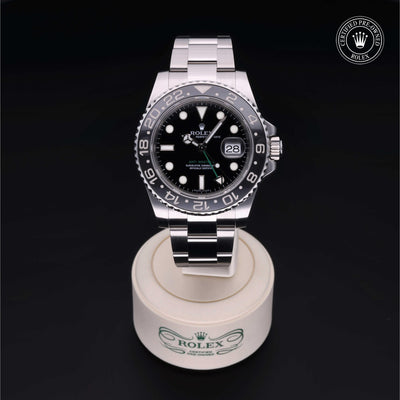 Rolex Certified Pre-owned GMT M116710LN-0001 front on black background