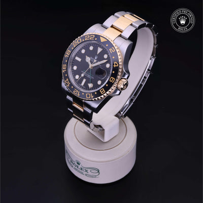 Rolex Certified Pre-owned GMT M116713LN-0001 front on black background