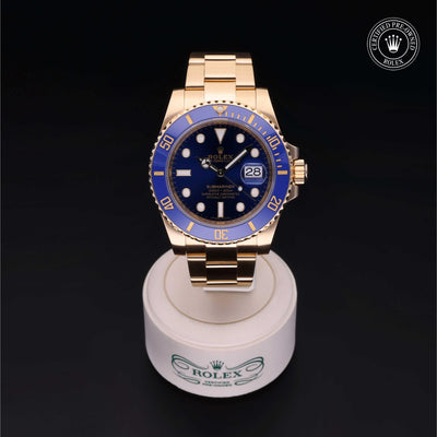 Rolex Certified Pre-owned Submariner M116618LB-0003 front on black background