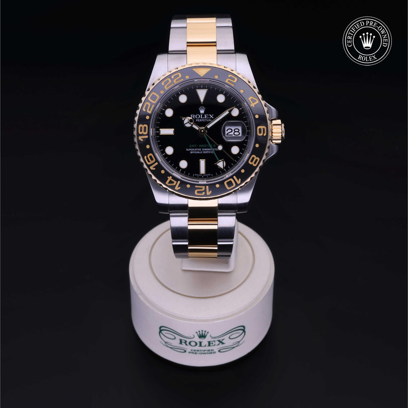 Rolex Certified Pre-owned GMT M116713LN-0001 front on black background