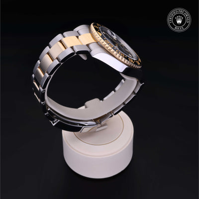 Rolex Certified Pre-owned GMT M116713LN-0001 front on black background