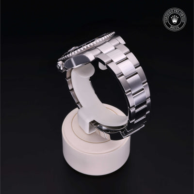 Rolex Certified Pre-owned GMT M116710LN-0001 front on black background
