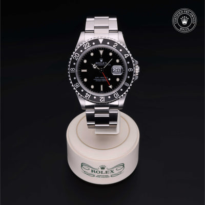 Rolex Certified Pre-owned GMT M16700LN-0001 front on black background