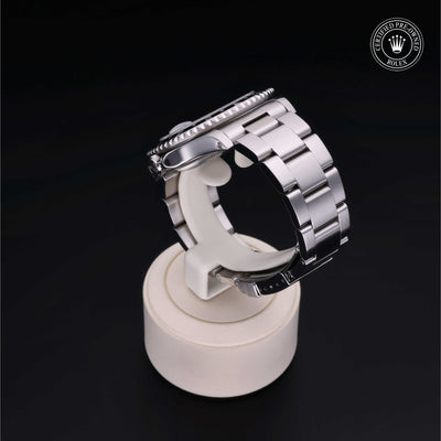 Rolex Certified Pre-owned GMT M16700LN-0001 front on black background