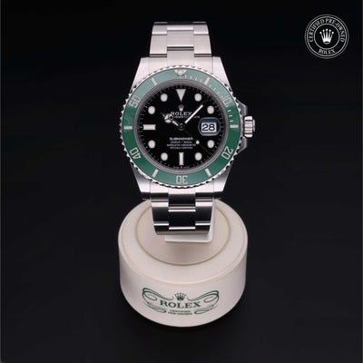 Rolex Certified Pre-owned Submariner M126610LV-0002 front on black background