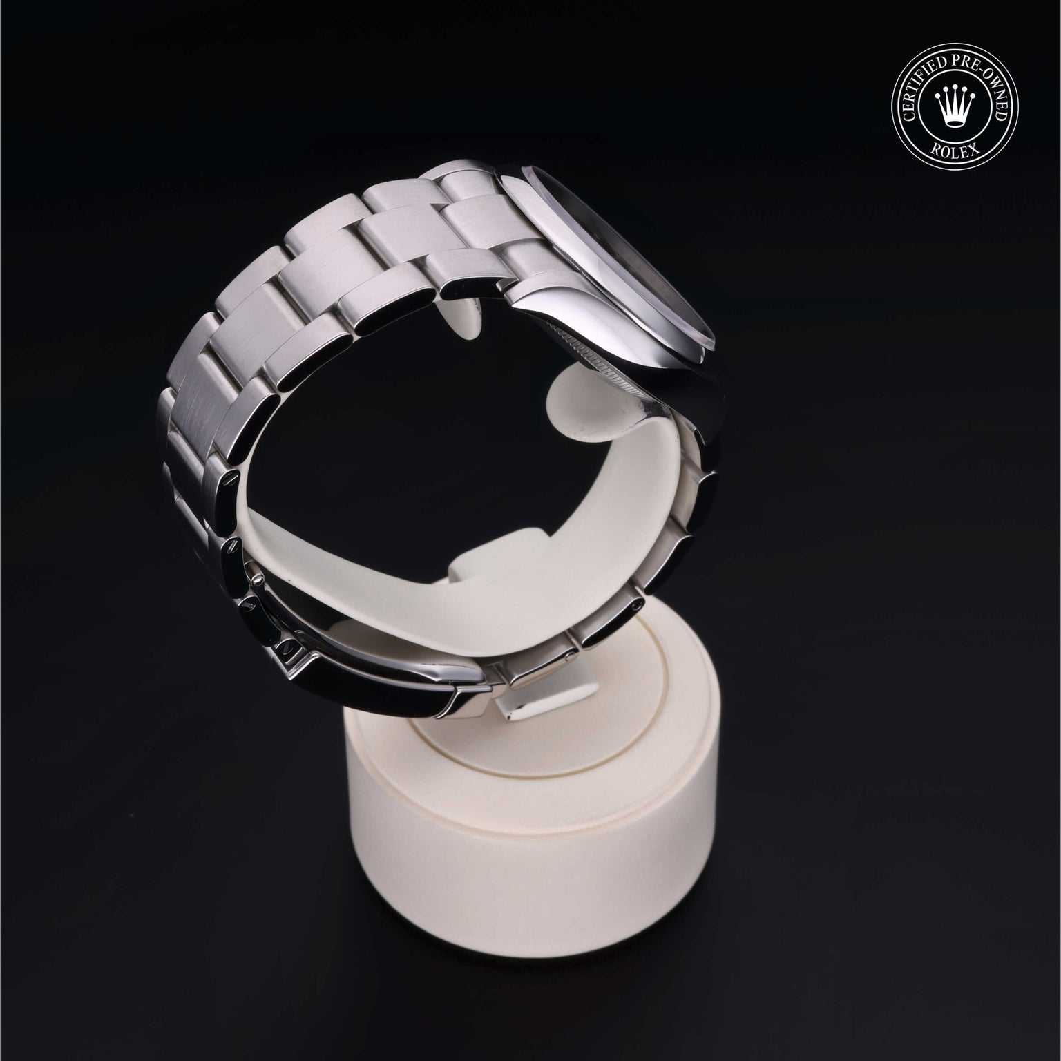 Rolex Certified Pre-owned Oyster Perpetual M126000-0005 front on black background
