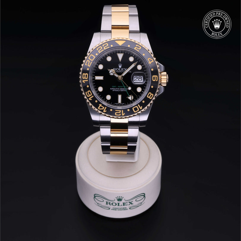 Rolex Certified Pre-owned GMT M116713LN-0001 front on black background