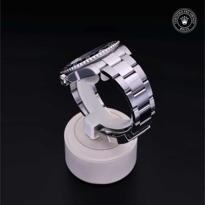 Rolex Certified Pre-owned GMT M116710LN-0001 front on black background