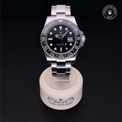 Rolex Certified Pre-owned GMT M116710LN-0001 front on black background