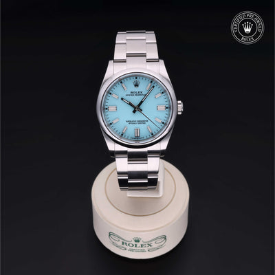Rolex Certified Pre-owned Oyster Perpetual M126000-0006 front on black background