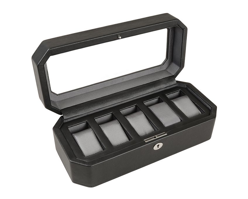Black watch box with glass top lid, five cushioned compartments inside, and metal lock on front.