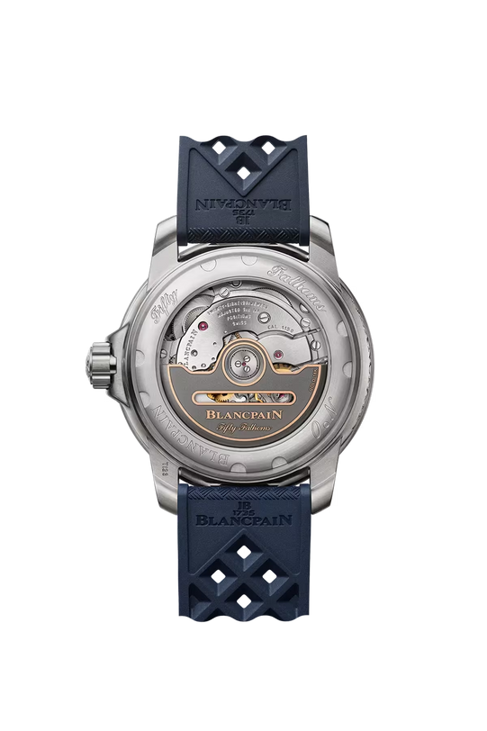 Blancpain Fifty Fathoms watch with stainless steel case, sunburst blue dial, and dark blue rubber strap with geometric patter
