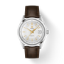 Tissot Visodate watch with silver case, white dial, gold-tone hands and indexes, date window, and brown leather strap.