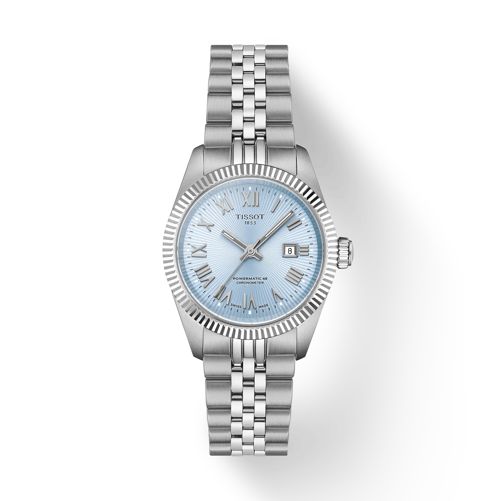The Tissot Ballade 30mm is a silver wristwatch with a light blue face, Roman numeral hour markers, a date window at 3 o’clock, and a stainless steel link bracelet, shown on a white background.