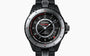 Chanel watch with black strap and detailed face on a white background