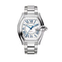 Silver Cartier watch with blue accents on a light beige background