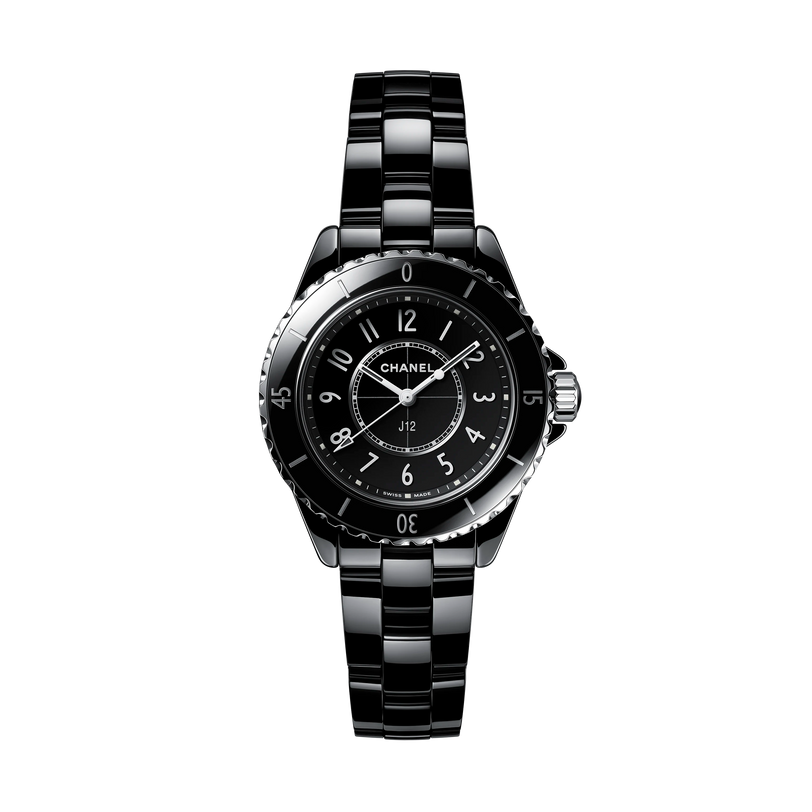 A Chanel J12 wristwatch with a black ceramic bracelet, round face, and silver markers is displayed on a plain white background.