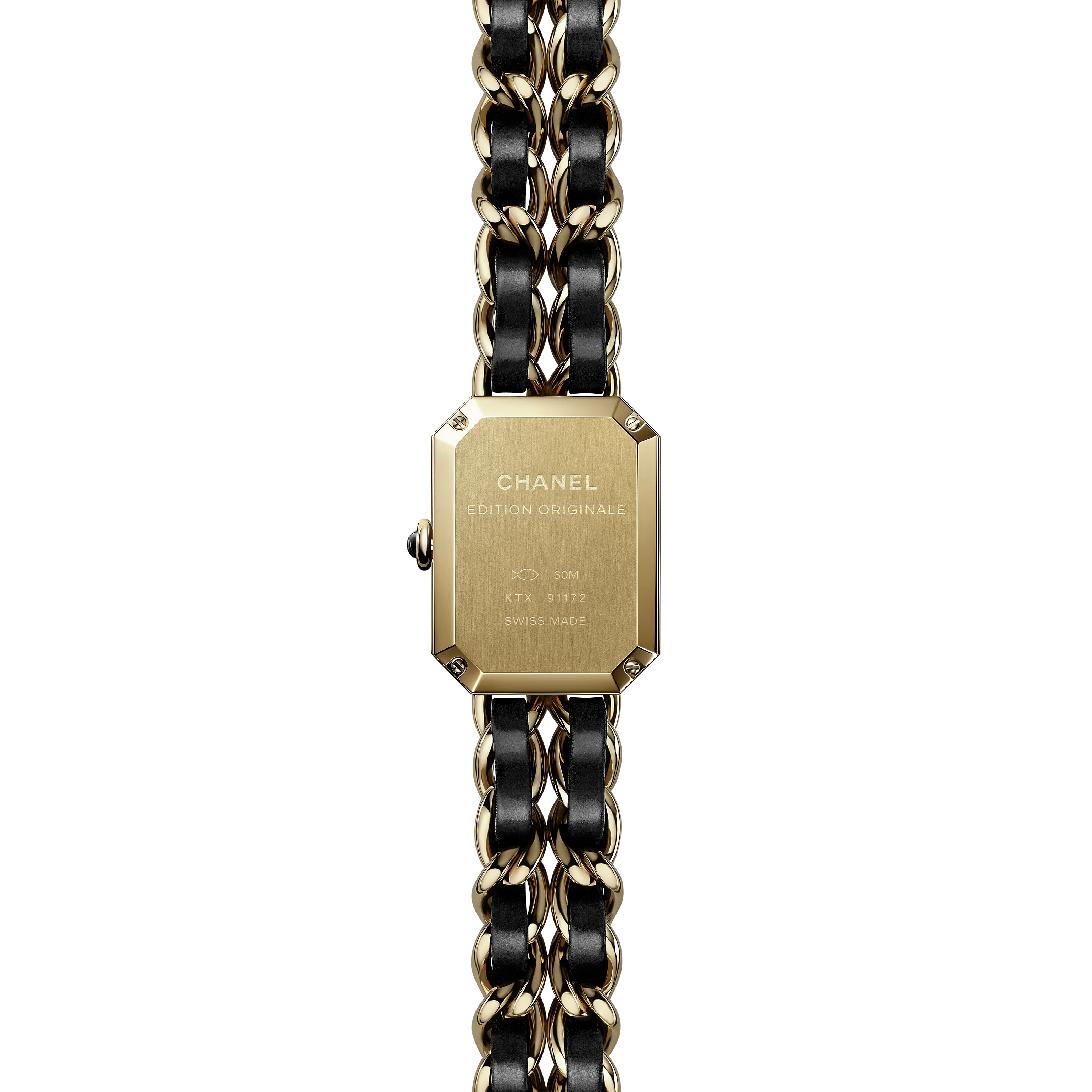 A close-up of the back of the Chanel Première Édition Originale Small Model, a rectangular yellow gold steel wristwatch with a black and gold chain-link band, engraved with CHANEL ÉDITION ORIGINALE and other details.