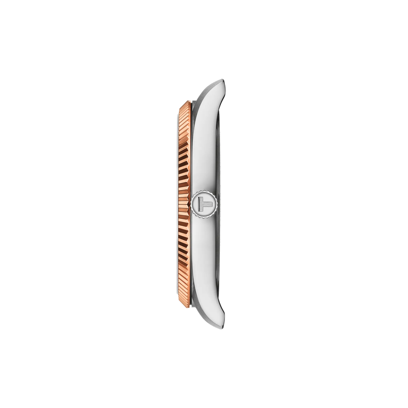 Silver and rose gold watch face on a white background