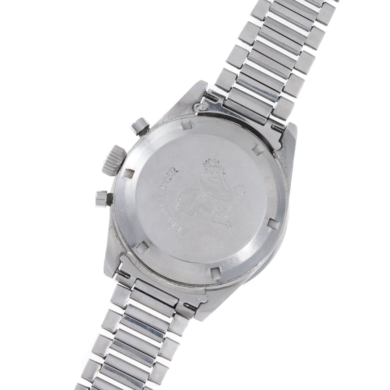 The back of the OMEGA Speedmaster features an engraved lion emblem and a silver metal link band.