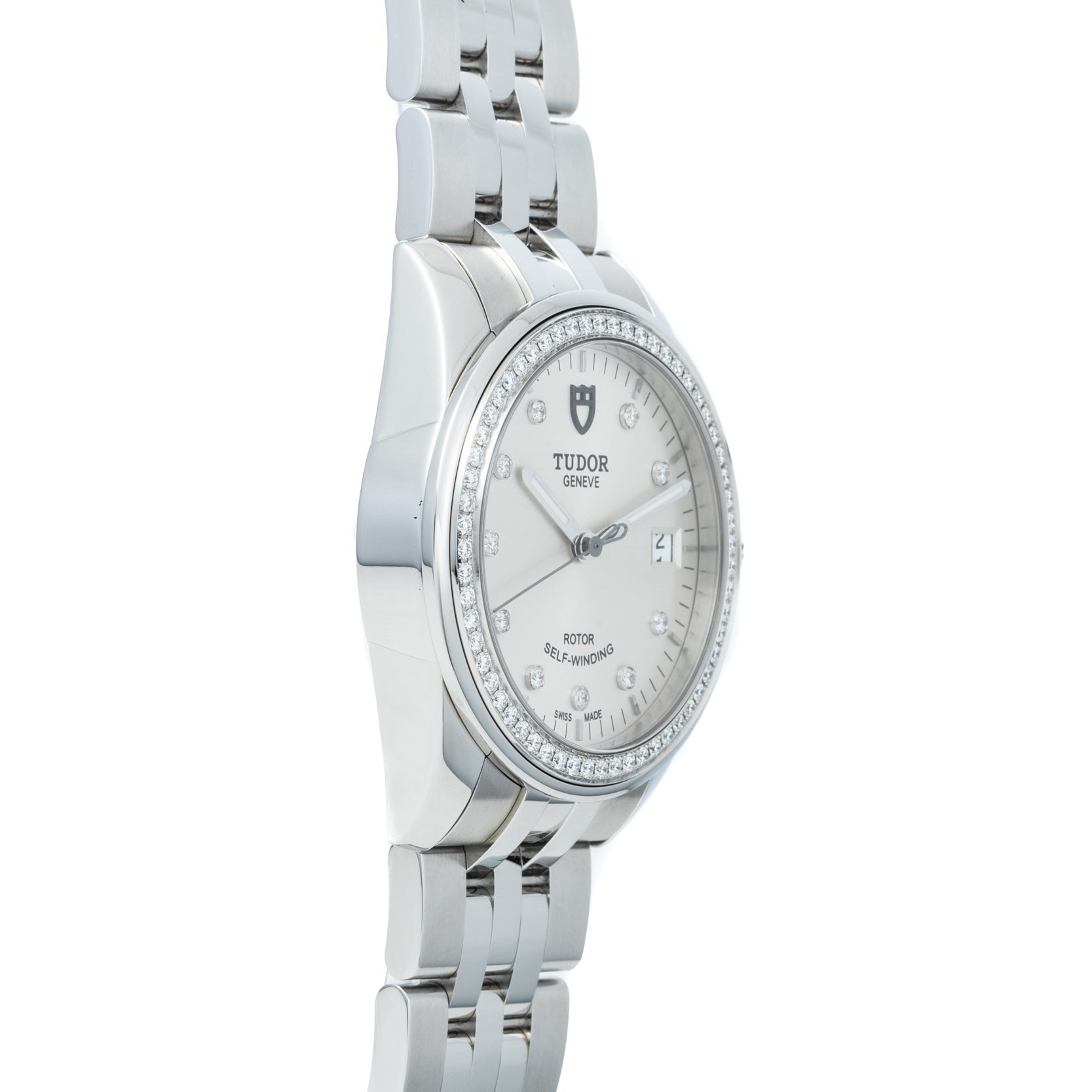 TUDOR Glamour Date wristwatch featuring a diamond bezel, metal bracelet, white dial with date display, and diamond hour markers.