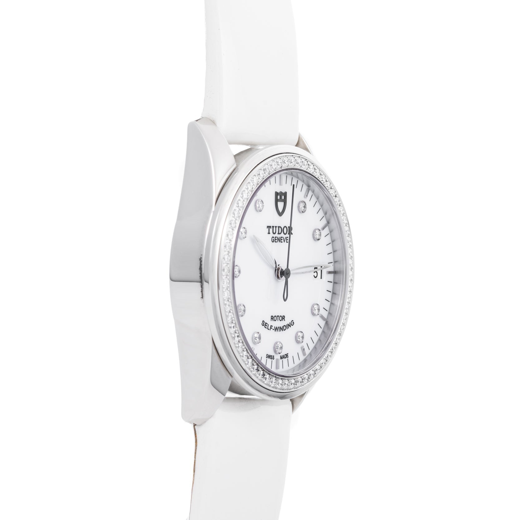 The TUDOR Glamour Date is a white wristwatch featuring a round face, diamond hour markers, and a white leather strap.