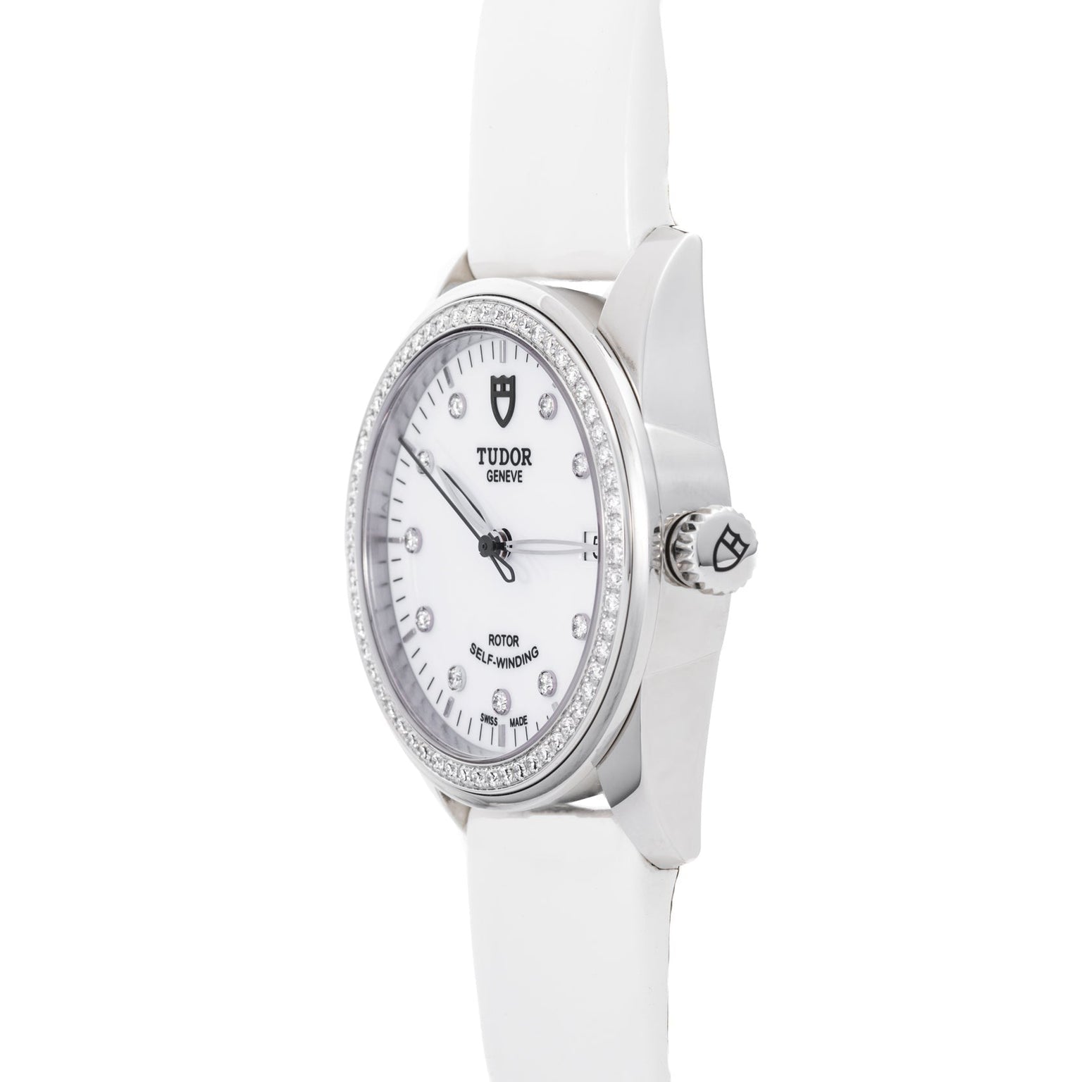 The TUDOR Glamour Date wristwatch features a white dial with diamond hour markers and a white leather strap, shown from an angled perspective.