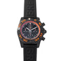 Breitling Chronomat Raven chronograph watch featuring orange accents and a black rubber strap.
