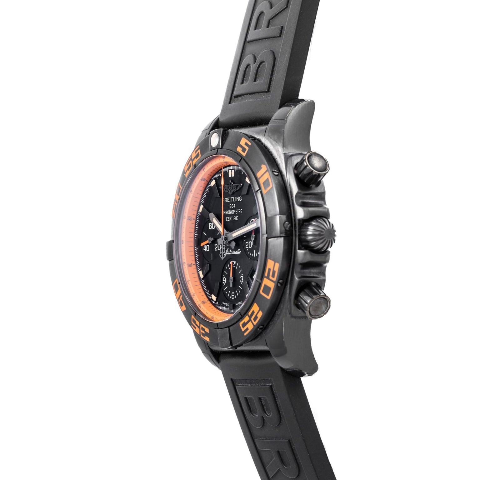 Side view of the Breitling Chronomat Raven wristwatch featuring orange accents and a black rubber strap.