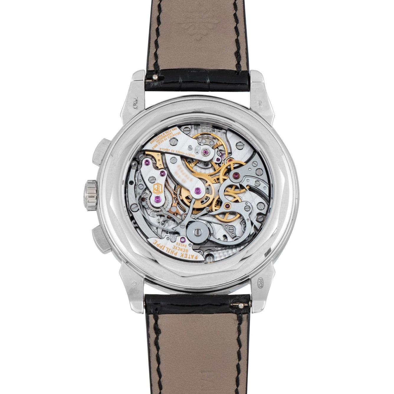 Back view of the Patek Philippe Perpetual Calendar Moonphase Chronograph, showcasing its intricate mechanical movement and gears, paired with a black leather strap.