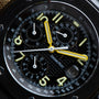 Close-up of the Audemars Piguet Royal Oak Offshore End of Days watch face, featuring yellow hands and bold white numerals on a black dial.
