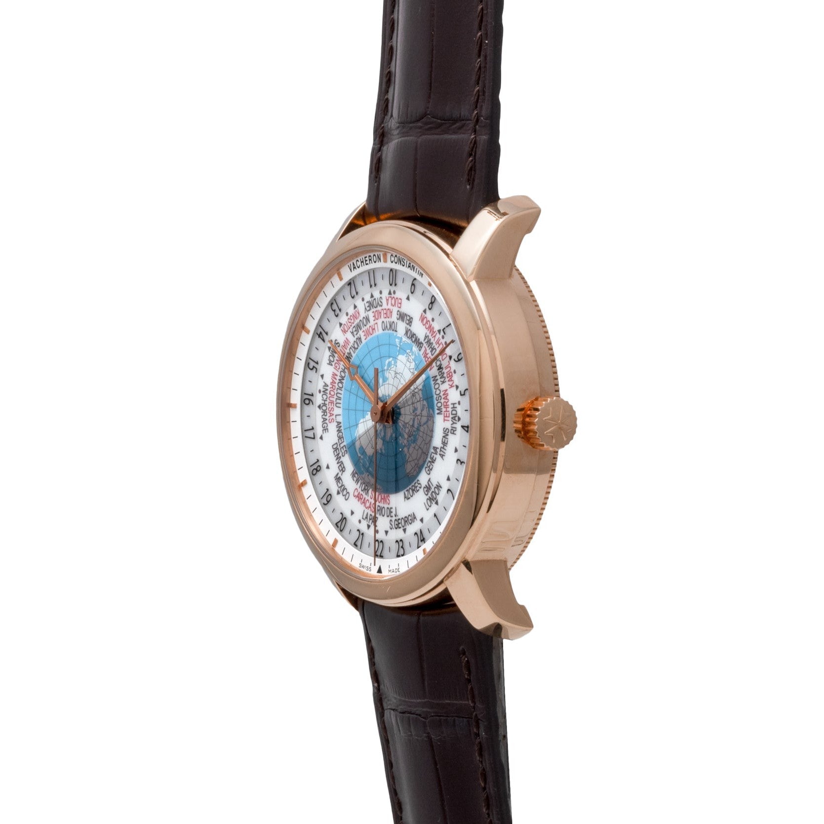 The Vacheron Constantin Traditionnelle World Time in rose gold features a brown leather strap, displayed at an angle against a white background.