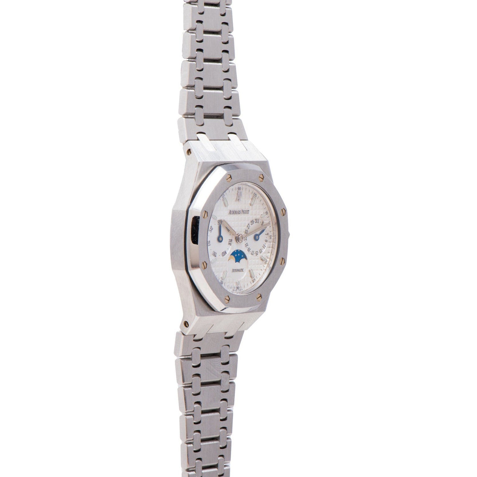 The Audemars Piguet Royal Oak Day-Date Moonphase is a silver luxury wristwatch with a metal band, white dial, and blue moon phase display.