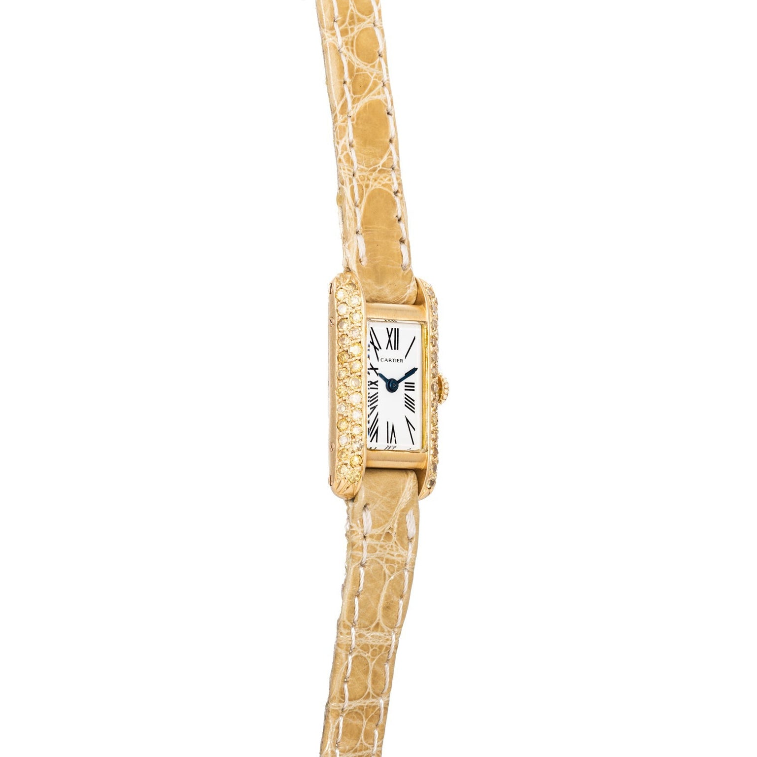 The Cartier Tank wristwatch features a gold case, a rectangular dial with Roman numerals, and a textured beige leather strap.