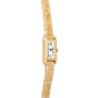 The Cartier Tank wristwatch features a gold case, a rectangular dial with Roman numerals, and a textured beige leather strap.