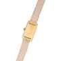 The Cartier Tank is a gold rectangular wristwatch with a beige leather strap, shown from the back displaying its case and detailed stitching.