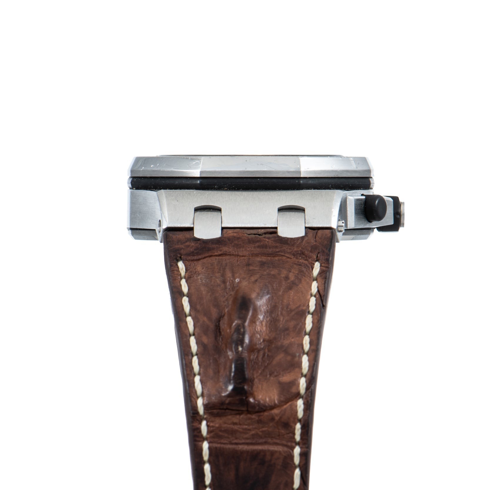 Side view of the Audemars Piguet Royal Oak Offshore Safari wristwatch featuring a brown leather strap and metal case, set against a white background.
