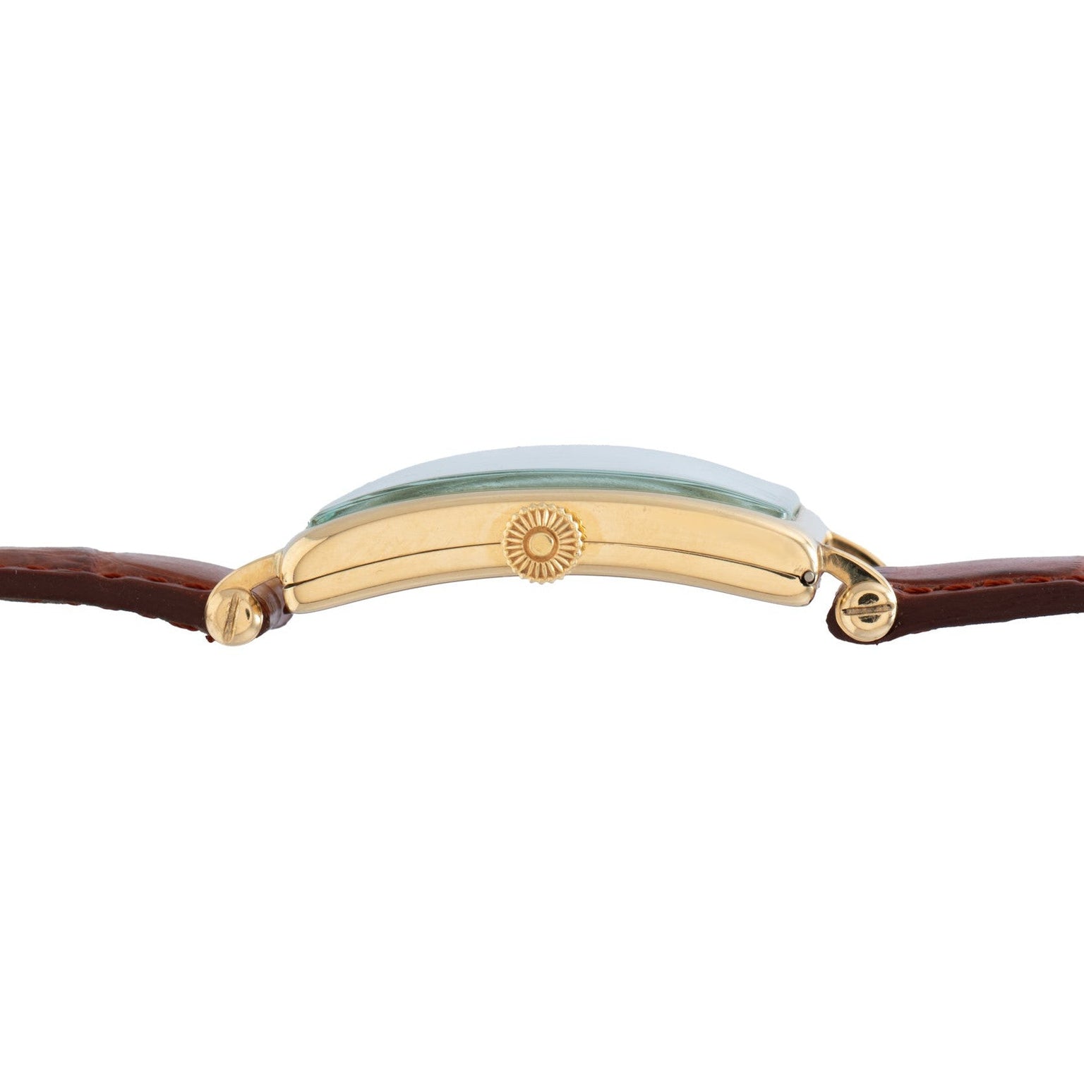 Side view of the Patek Philippe Birks Rectangular Dress Watch, featuring a gold case, brown leather strap, and a green-tinted crystal face.