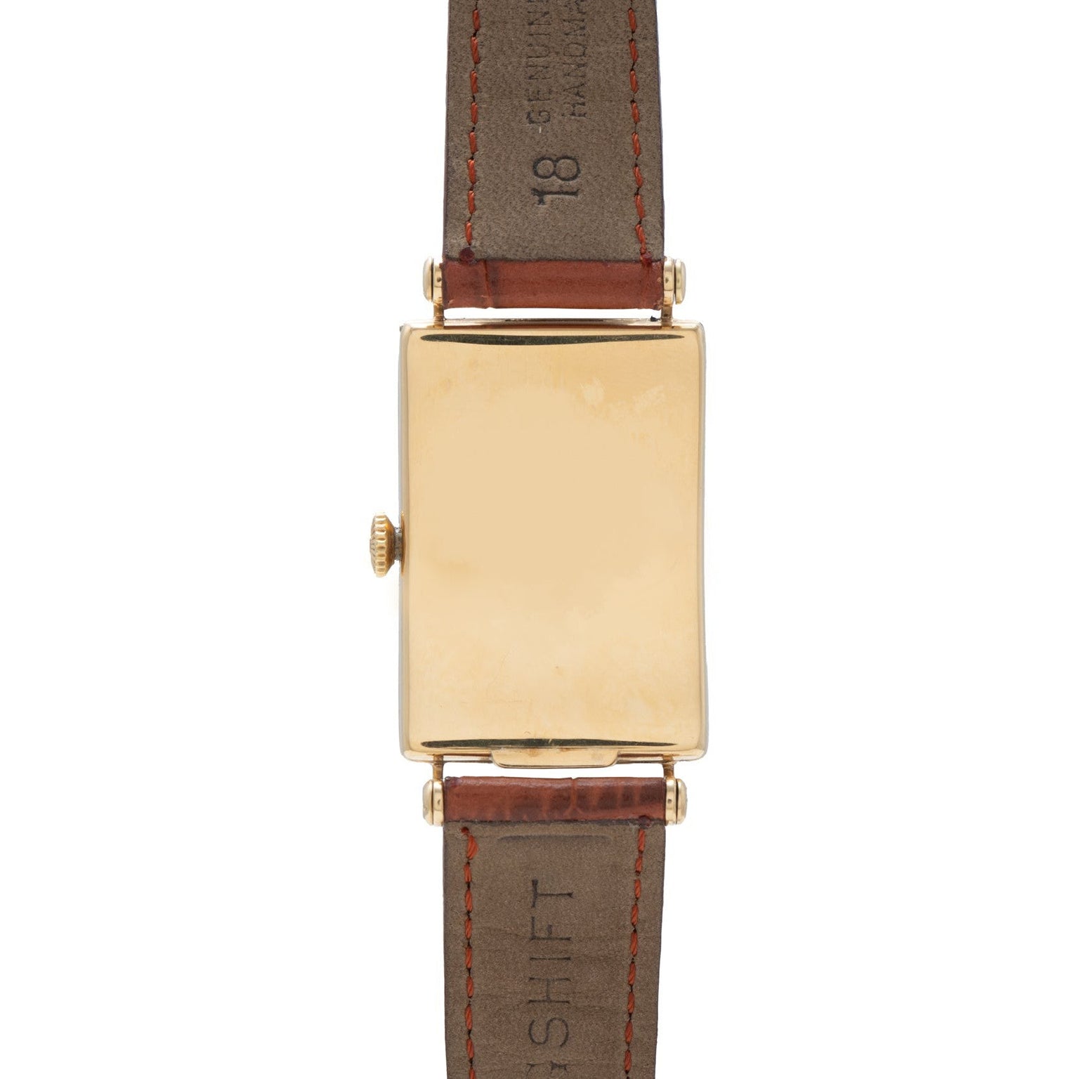 The Patek Philippe Birks Rectangular Dress Watch features a blank gold face and brown leather strap.