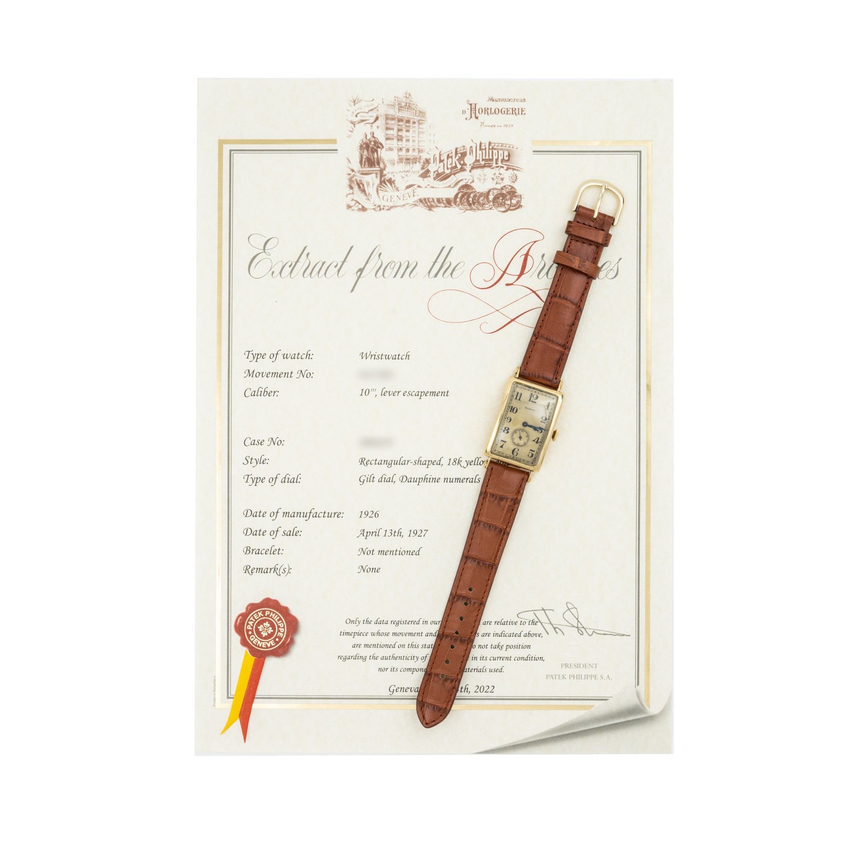 A Patek Philippe Birks Rectangular Dress Watch with a brown leather strap is placed on an official certificate document.