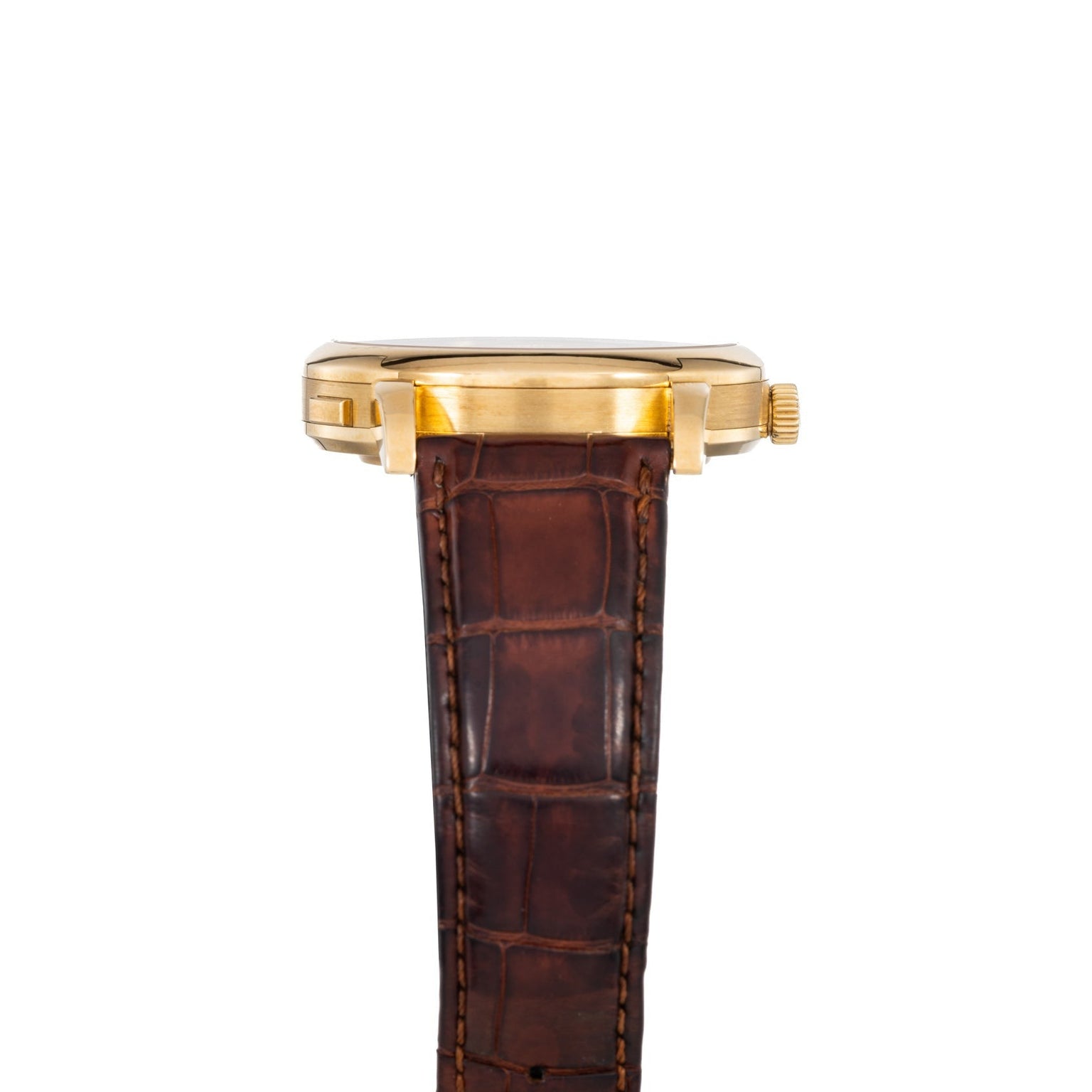 Side view of the Lange & Sohne Lange 1 Timezone gold wristwatch featuring a brown leather strap and visible crown.