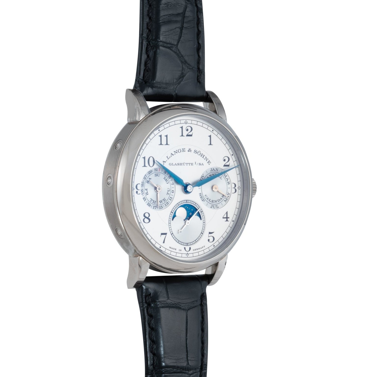 The Lange & Sohne Lange 1815 Annual Calendar is a luxury wristwatch featuring a white dial, blue hands, black leather strap, and multiple subdials for complications.