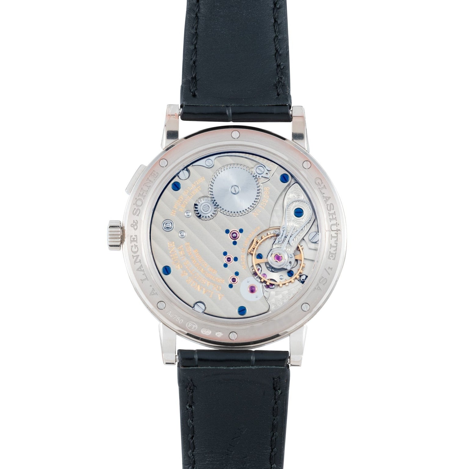 Back view of the Lange & Sohne Lange 1815 Annual Calendar reveals its intricate mechanical movement and elegant black leather strap.