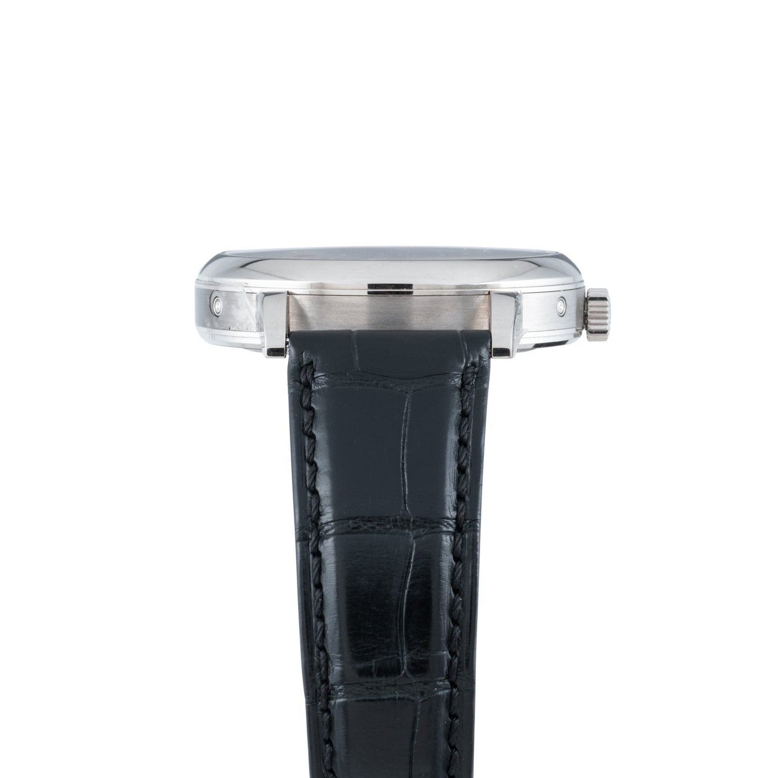 Side view of the Lange & Sohne Lange 1815 Annual Calendar, a silver wristwatch with a black leather strap, shown against a white background.