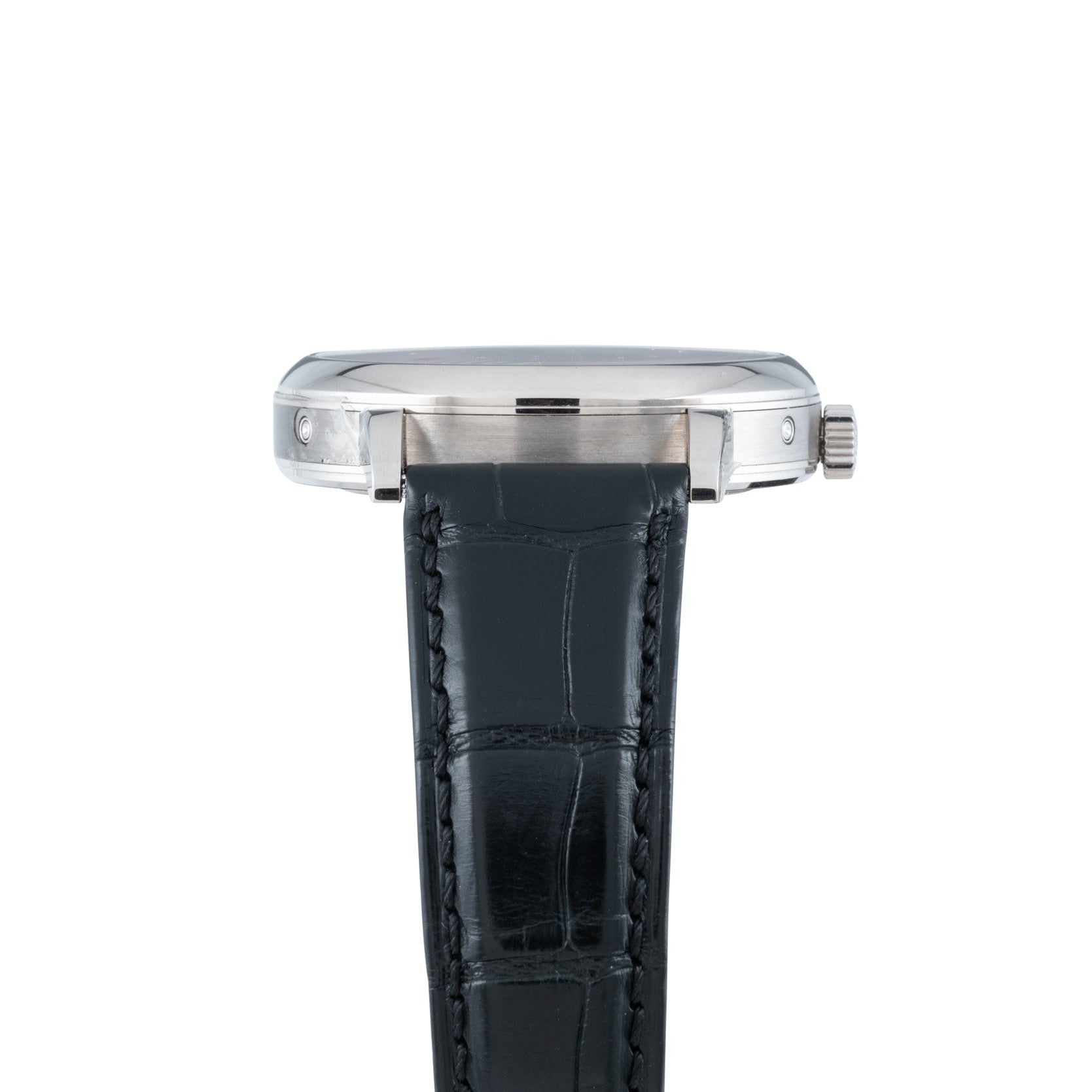 Side view of the Lange & Sohne Lange 1815 Annual Calendar, a silver wristwatch with a black leather strap, shown against a white background.
