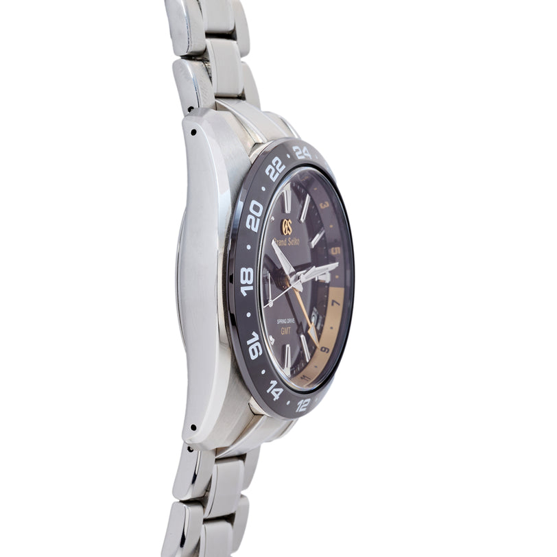 Silver watch with a black face on a white background