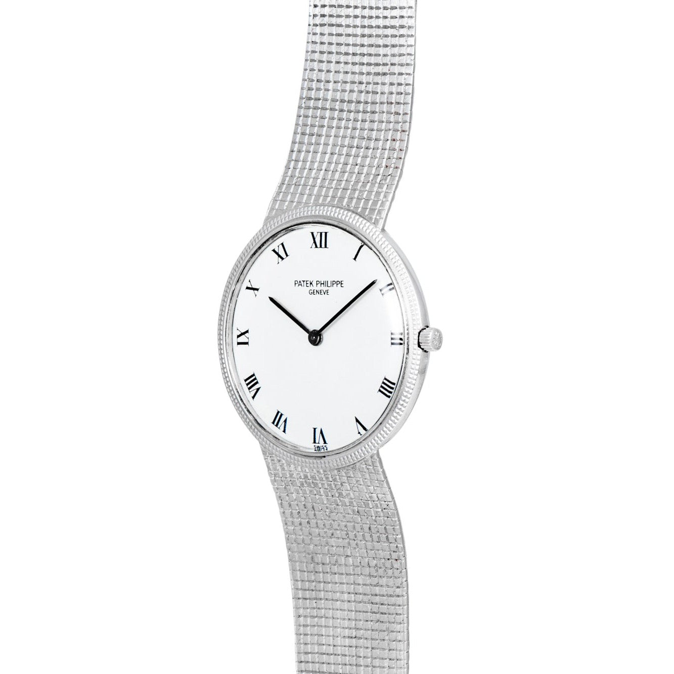 The Patek Philippe Calatrava features a silver case, white dial with Roman numerals, and a textured metal bracelet.