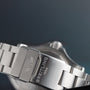 Close-up of a silver Breitling Avenger II Seawolf watch clasp, engraved with the logo and BREITLING 1884 on a metal band.