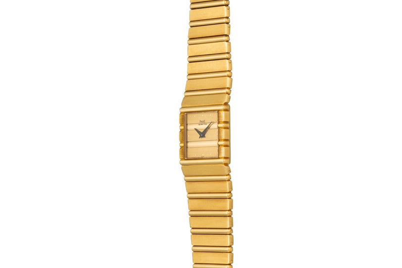 The Piaget Polo is a gold rectangular wristwatch featuring a matching gold linked band, shown against a white background.